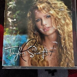 Taylor Swift CD with Vibrant Blue and Gold Design